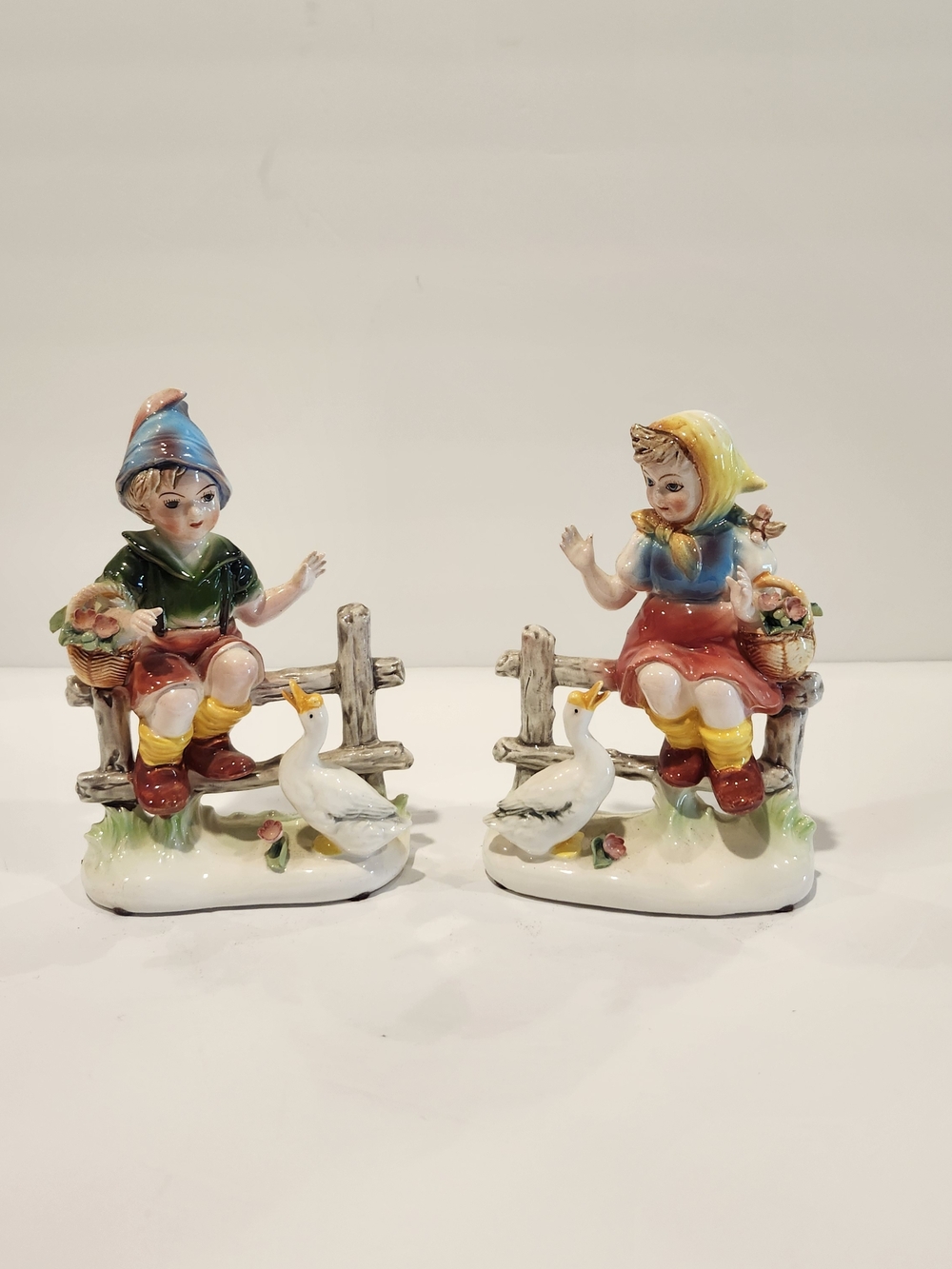 Lot Of 2 Figurines Boy And Girl On Fence With Goose